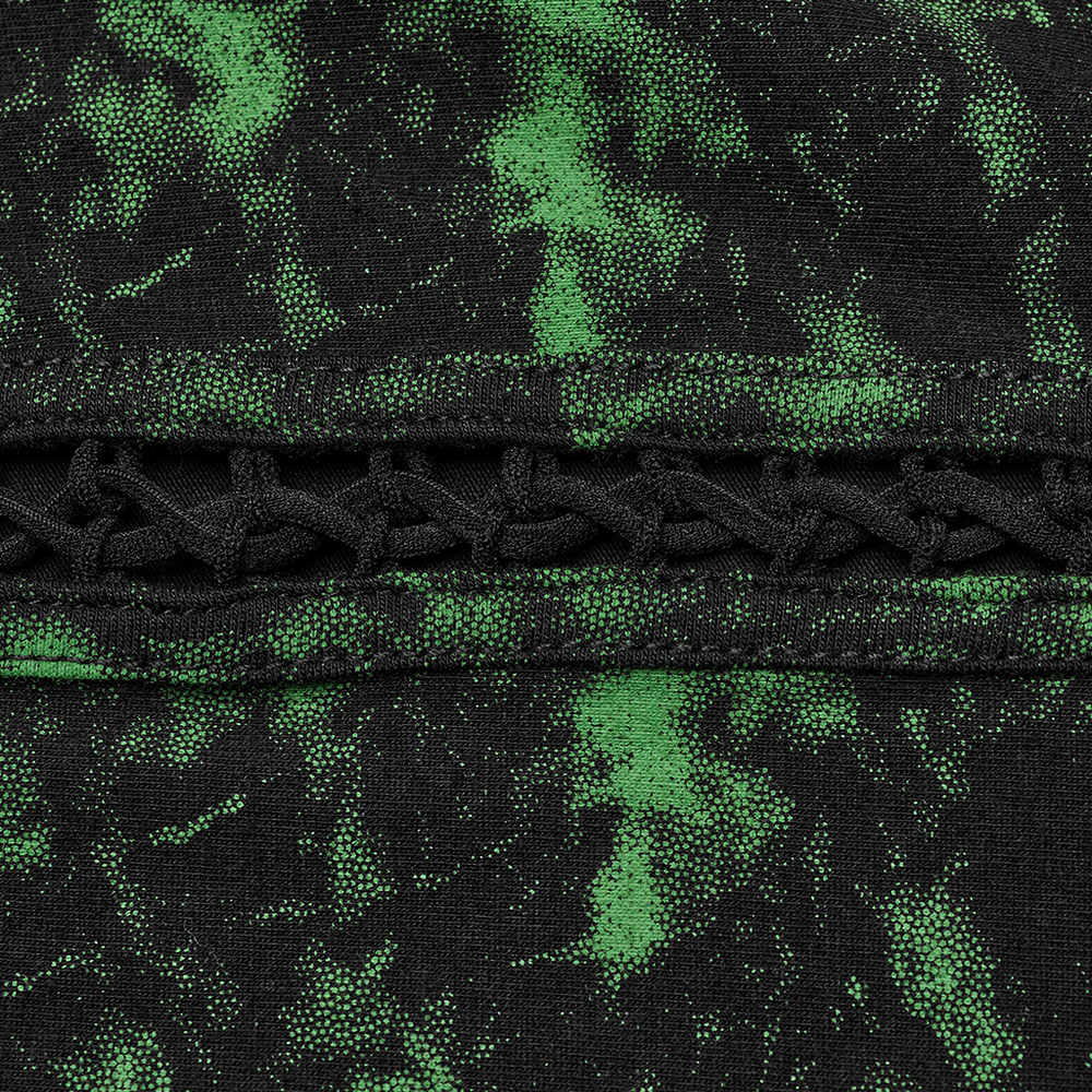 Close-up of edgy punk knit top with green splatter print and unique black hollow drawstring detail.