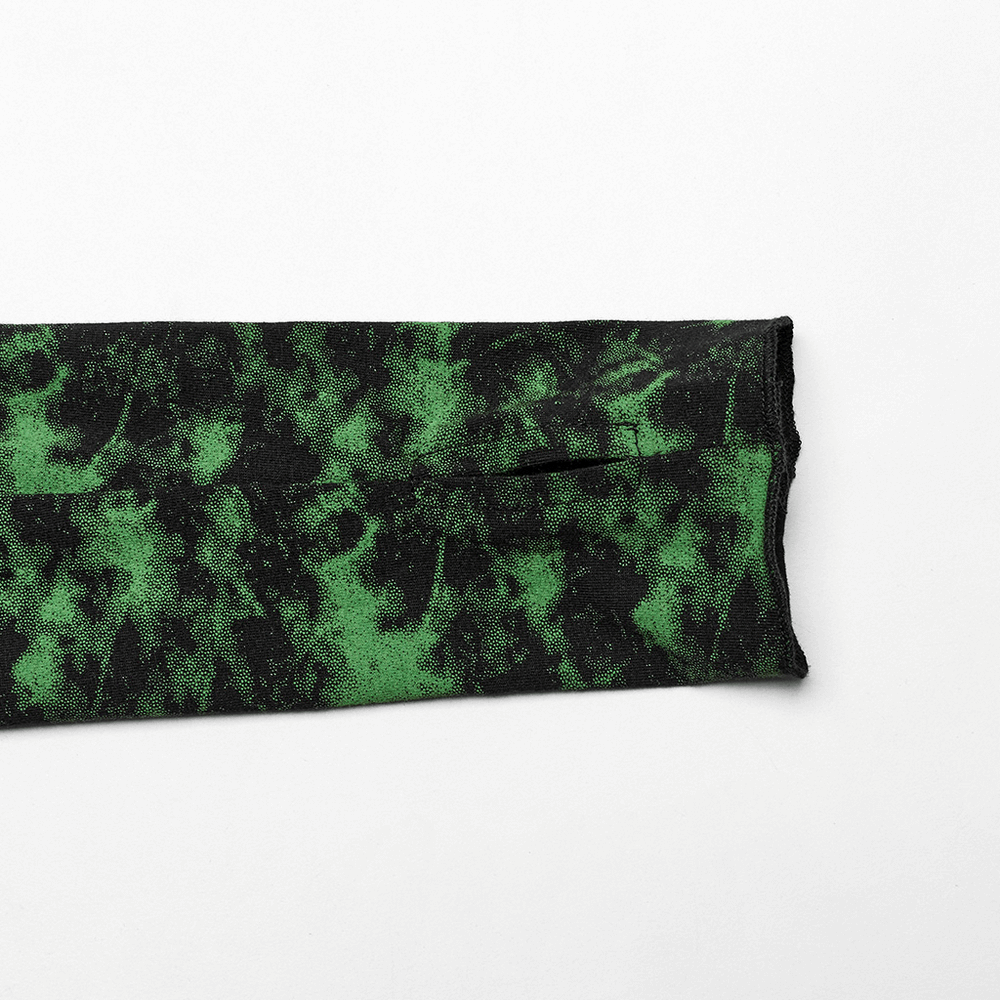 Close-up of edgy punk top's irregular hem in green and black tie-dye pattern.