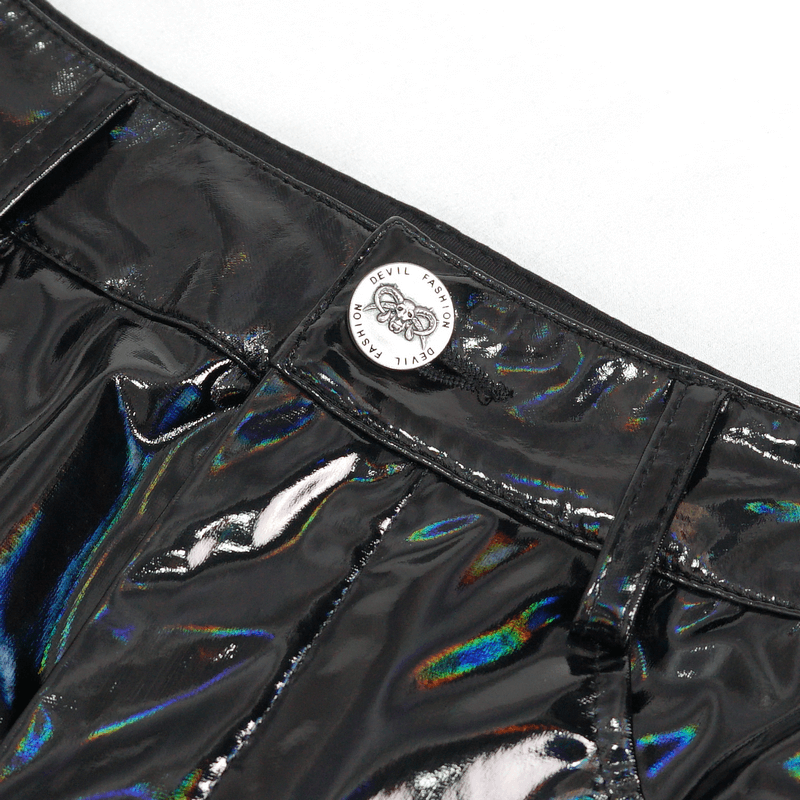 Close-up of a glossy black faux leather skirt featuring a unique tag and shiny surface details.