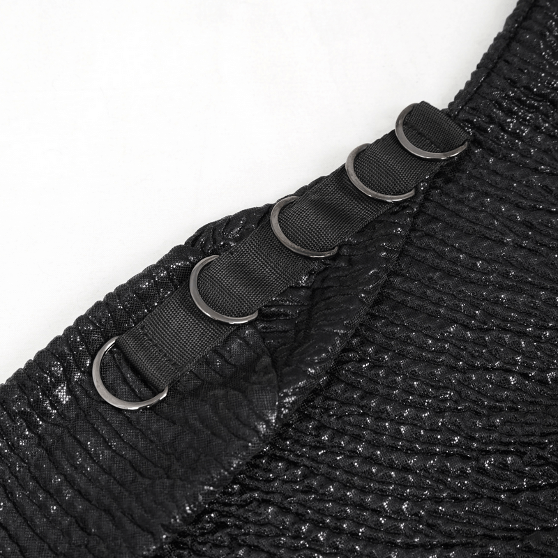 Close-up of black punk top detailing with strap and metal rings, showcasing stylish punk fashion elements.