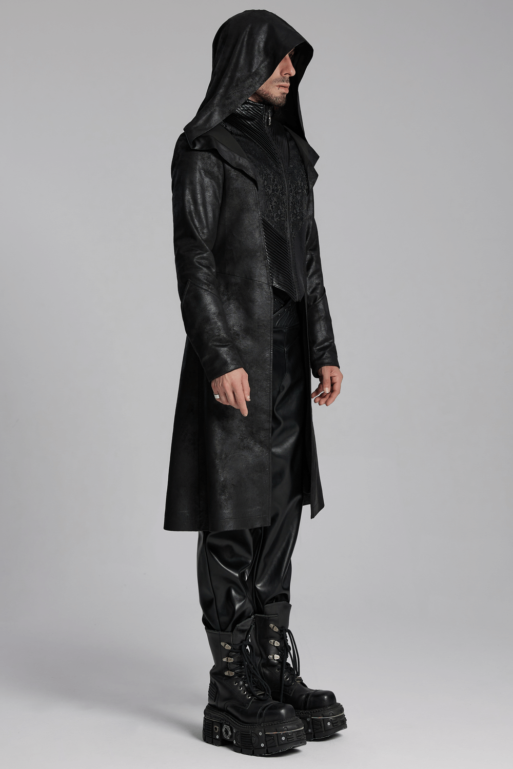 Stylish man in a dark hooded gothic wizard coat with cracked leather texture and sleek design. Perfect for a mysterious look.