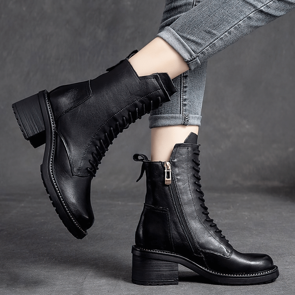 Stylish black leather ankle boots with lace-up details, perfect for modern casual looks.
