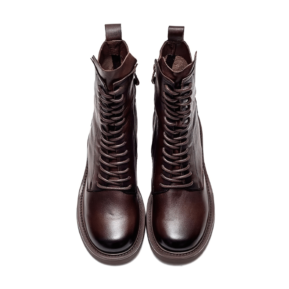Trendy genuine leather ankle boots for women, featuring lace-up design and modern casual style in rich brown color.