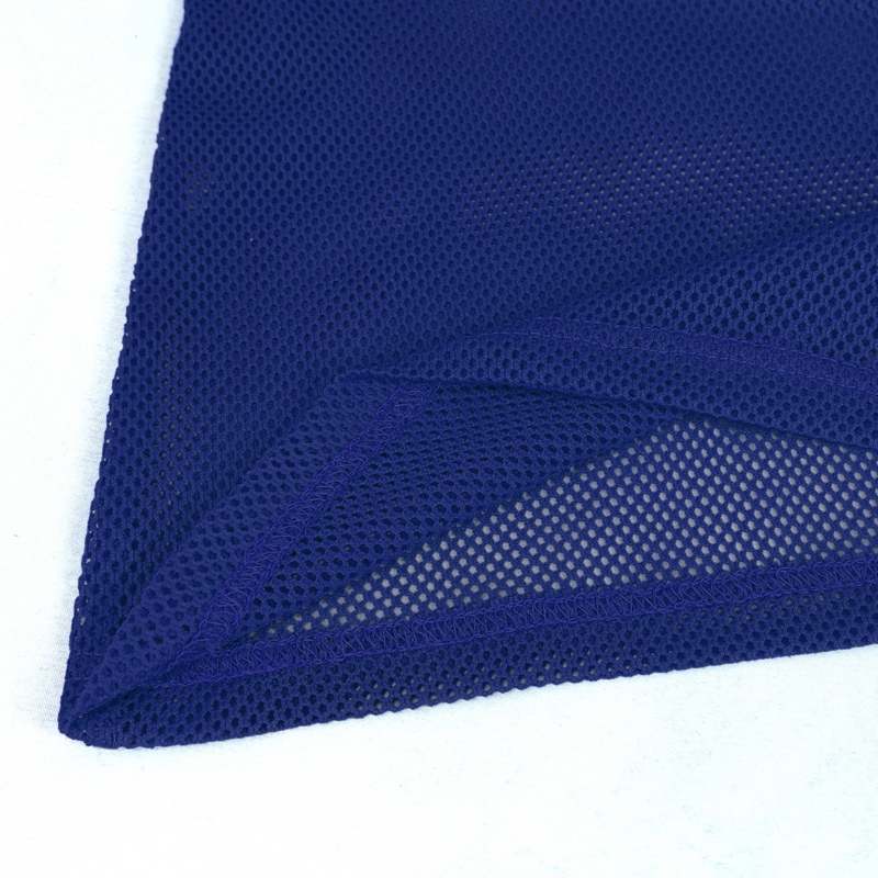 Close-up of blue mesh fabric showcasing the soft, stretchy texture and breathable design of a men's long sleeve top.