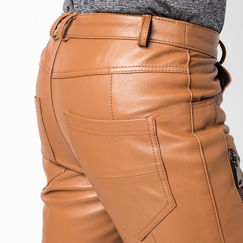 Fashion men's casual skinny pants in tan leather with decorative zippers and stylish back pockets.