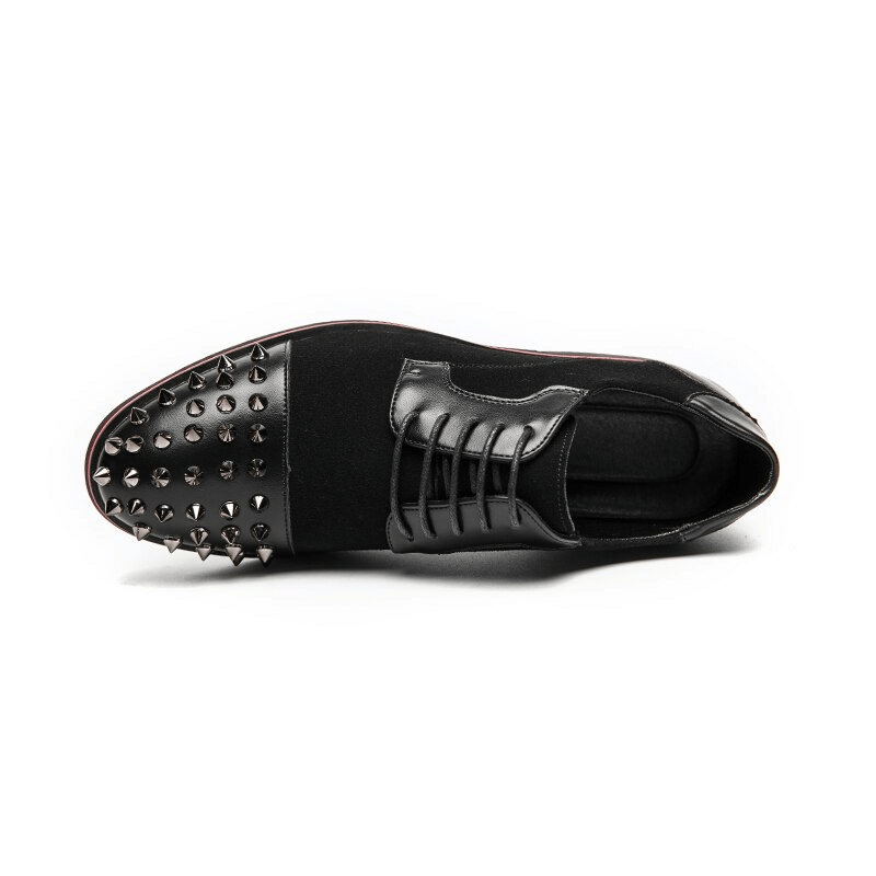 Men's black dress shoes with spikes, featuring stylish lace-up design and bold alternative fashion.