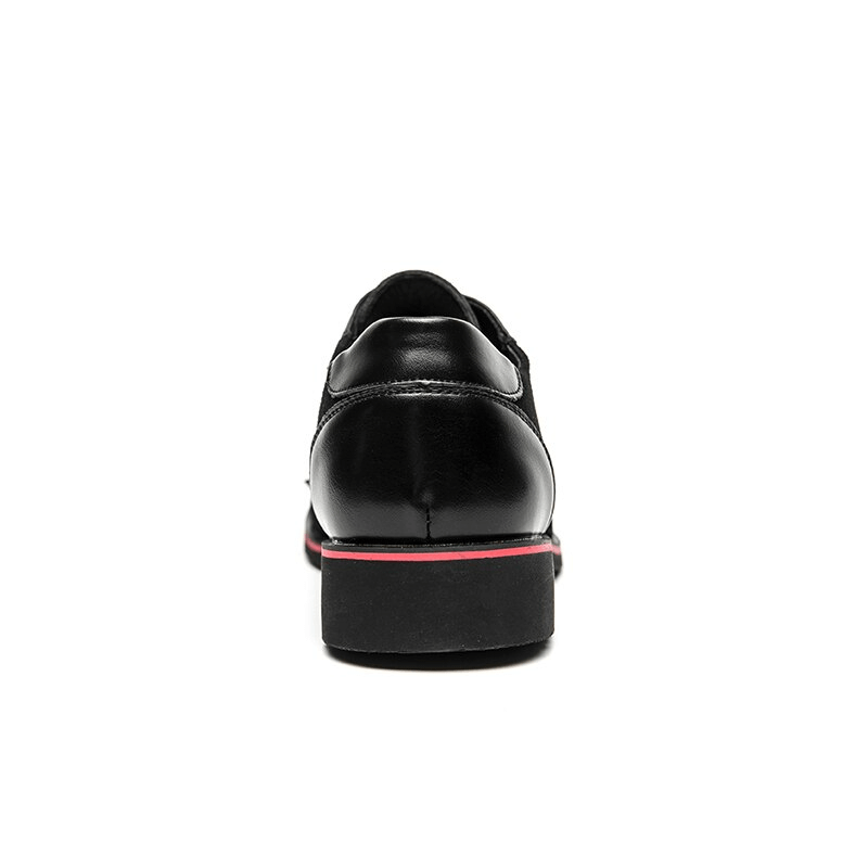 Back view of men's dress shoes with spikes, featuring stylish black design and a trendy red sole.