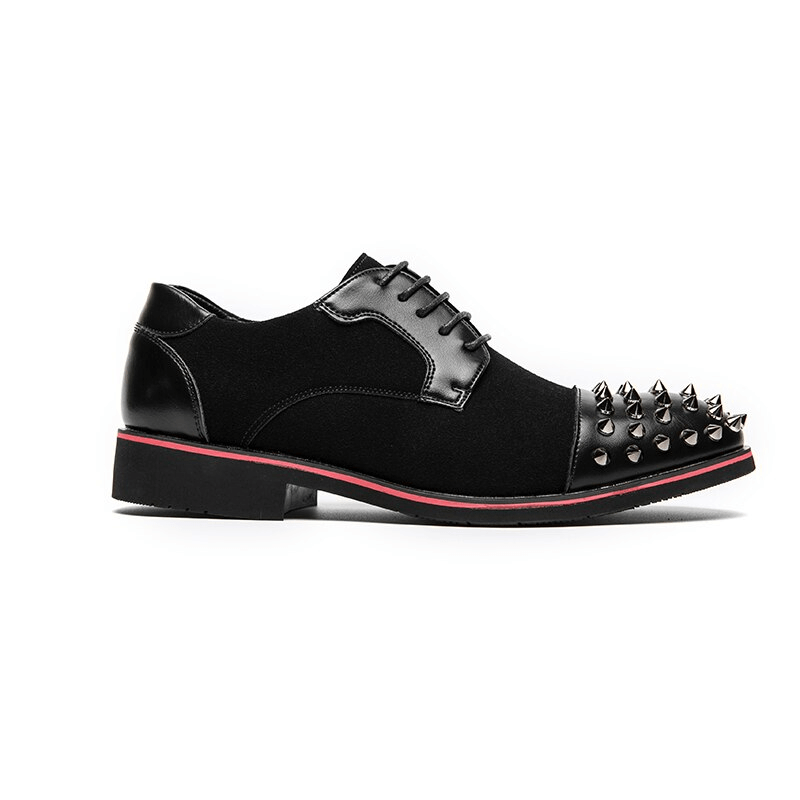 Men's black lace-up dress shoes with bold spikes and red accents for an alternative fashion statement.