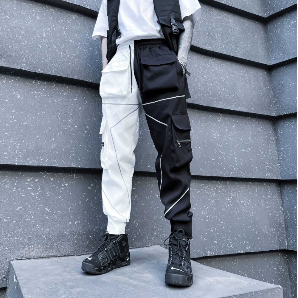 Fashion men's patchwork cargo trousers in black and white with pockets, perfect for an edgy, stylish look.