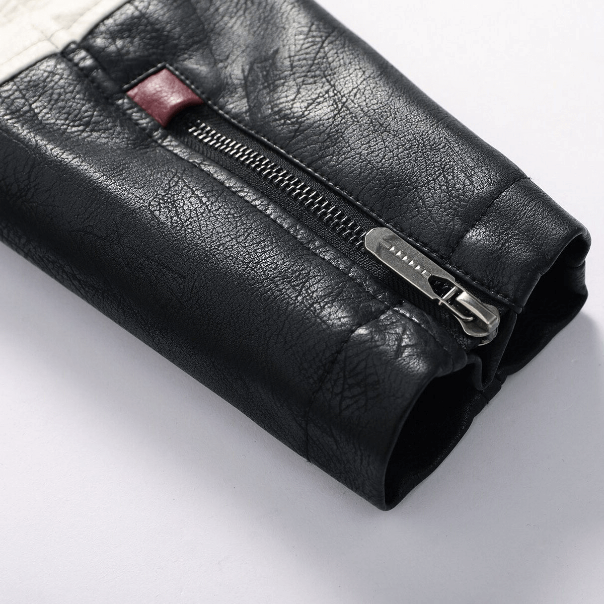 Close-up of the zipper detail on a men's black PU leather motorcycle jacket sleeve, showcasing stylish biker clothing.