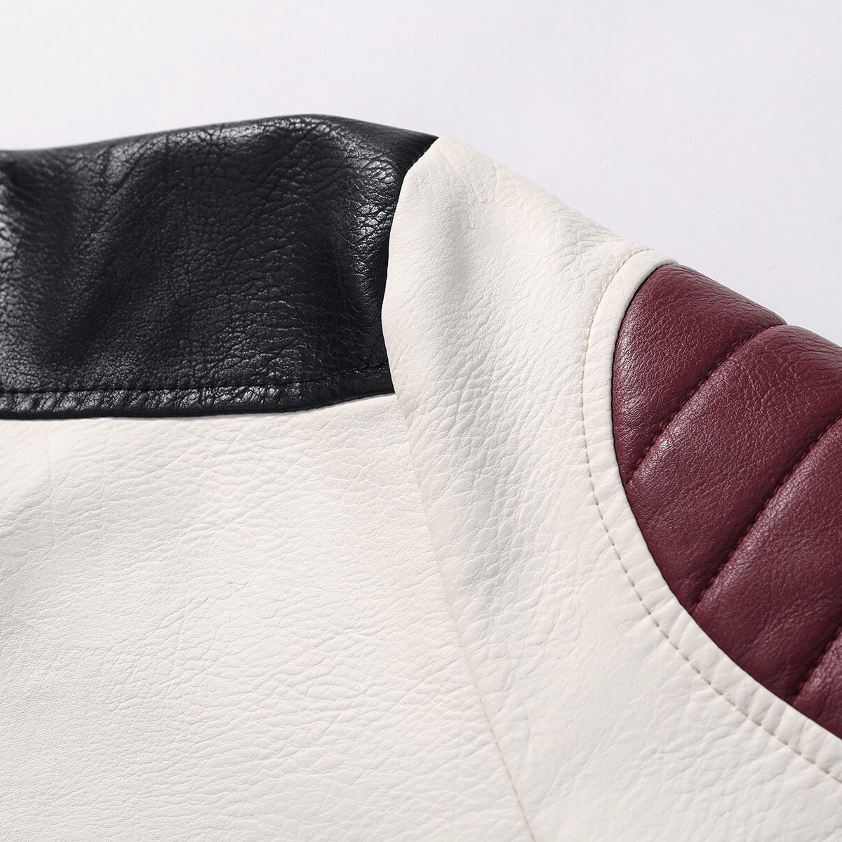 Close-up of stylish men's PU jacket featuring contrasting black and burgundy accents for a trendy biker look.