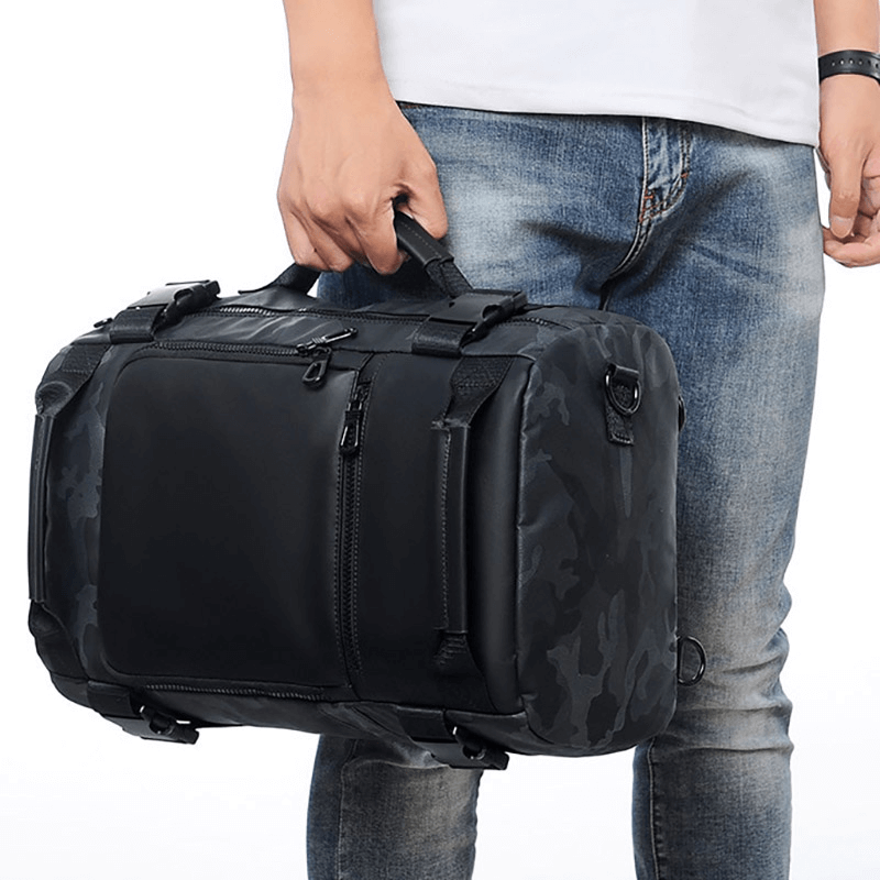 Stylish black camouflage backpack held by a person, showcasing a blend of fashion and functionality.