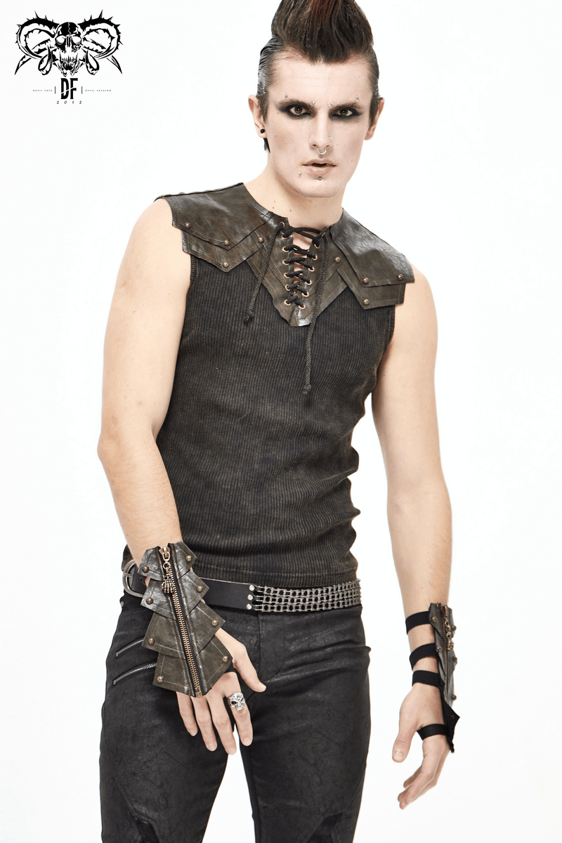 Fashionable gothic man wearing a sleeveless top and edgy accessories, showcasing a bold alternative style.