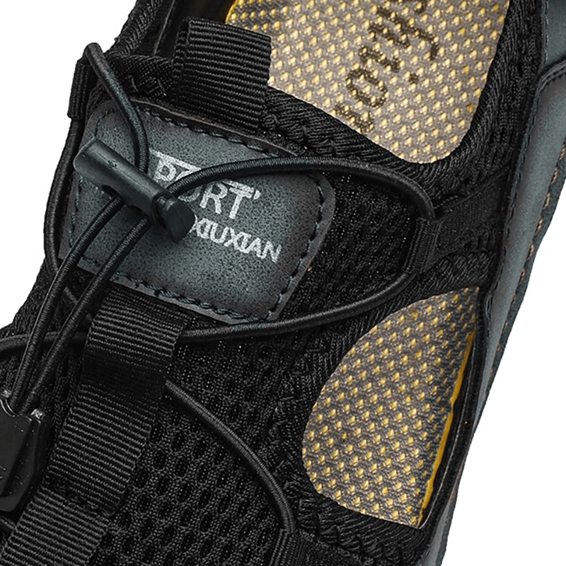 Close-up of a stylish black non-slip leather sandal for men, featuring breathable mesh and durable construction.