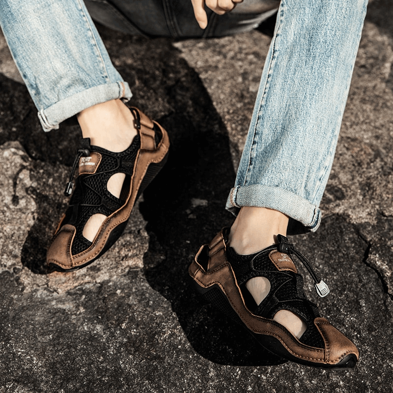 Men's breathable non-slip leather sandals showcasing casual outdoor style and comfort on rocky terrain.