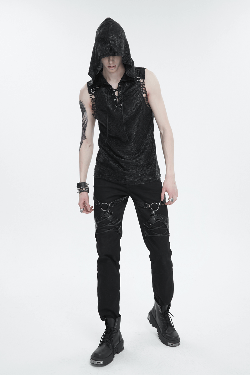 Stylish man in a black hooded punk tank top, showcasing a lace-up front and gothic flair, perfect for a rebellious look.