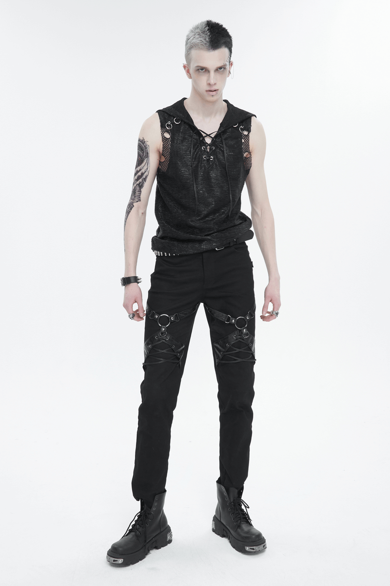 Model showcasing a punk gothic hooded tank top with lace-up detail and edgy black pants, embodying rebel style.