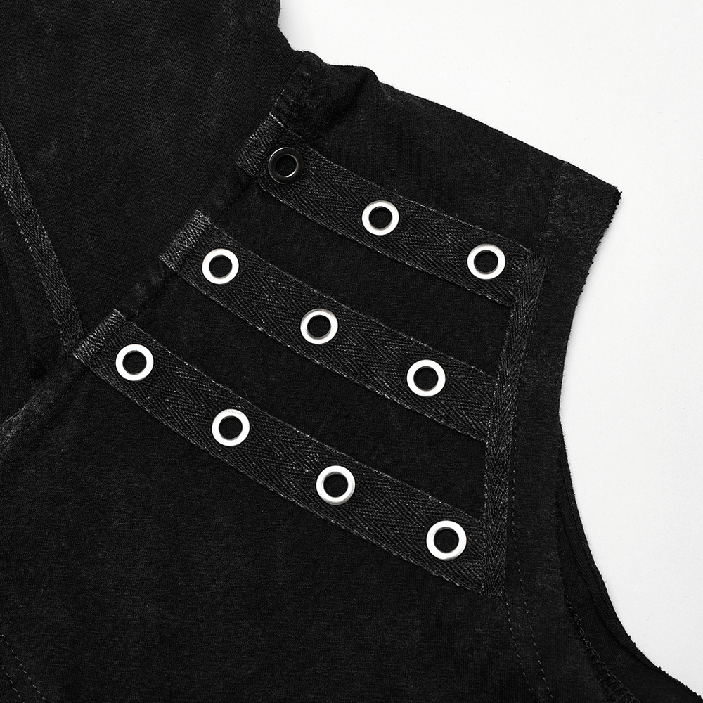 Close-up of punk vest shoulder showing eyelet detailing and distressed fabric texture.