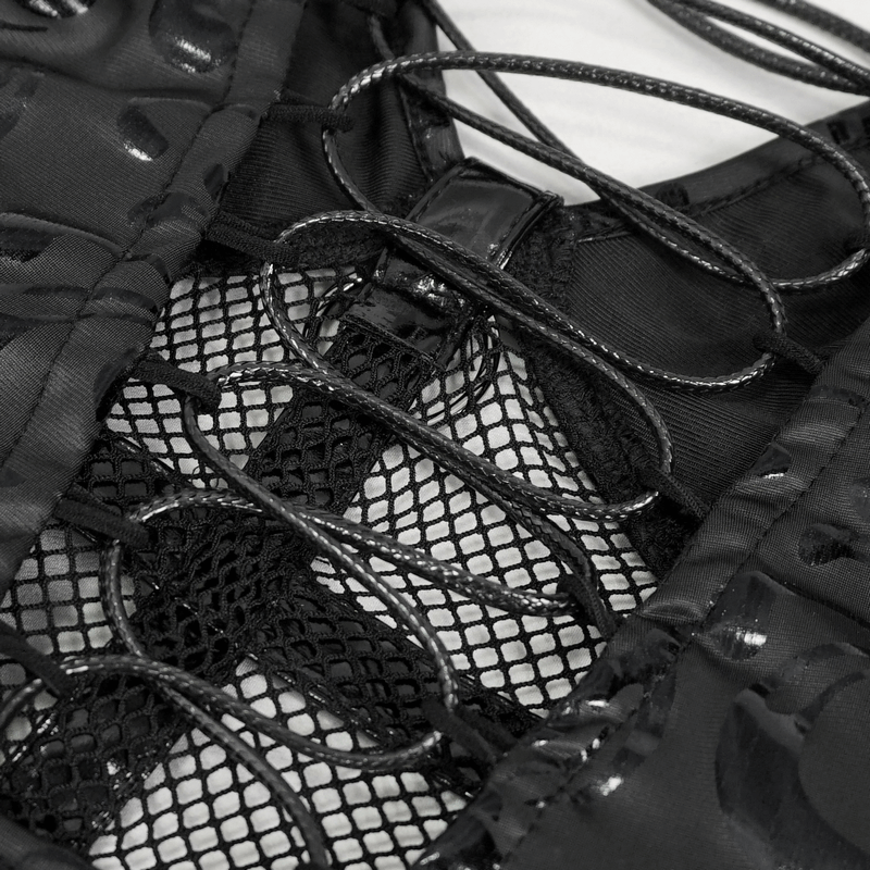 Close-up of the lace-up back detail on a fashion punk V-neck dress with bold hollow-out pattern.