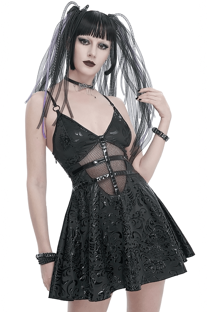 Model showcasing a punk V-neck short dress with lace-up back and edgy hollow-out details.