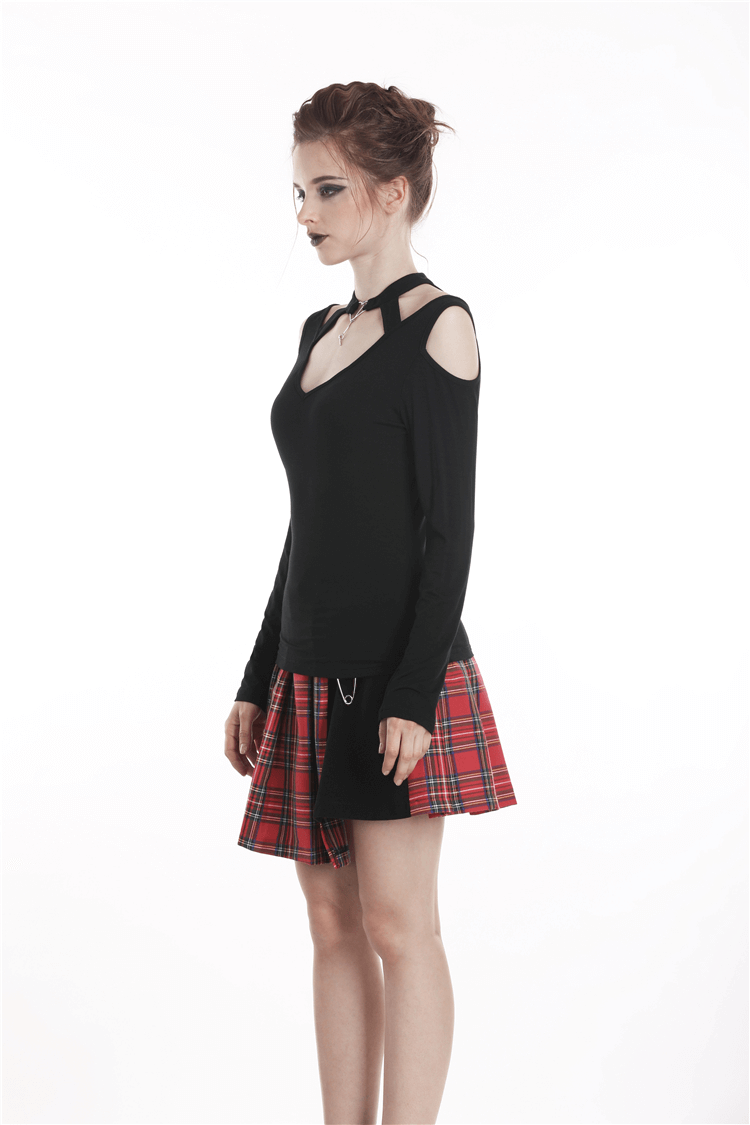 Edgy black off-shoulder choker top with heart cut-out, paired with a stylish plaid skirt.