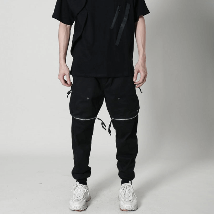 Men's black tactical zipper trousers with elastic waist, stylishly paired for an edgy look.