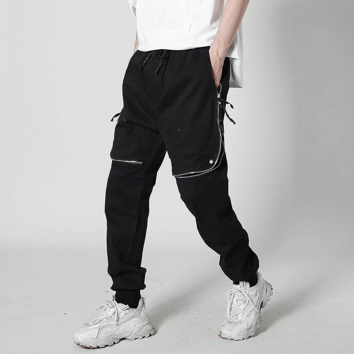 Men's fashion tactical zipper trousers with elastic waist, perfect for day-to-night styling in black.
