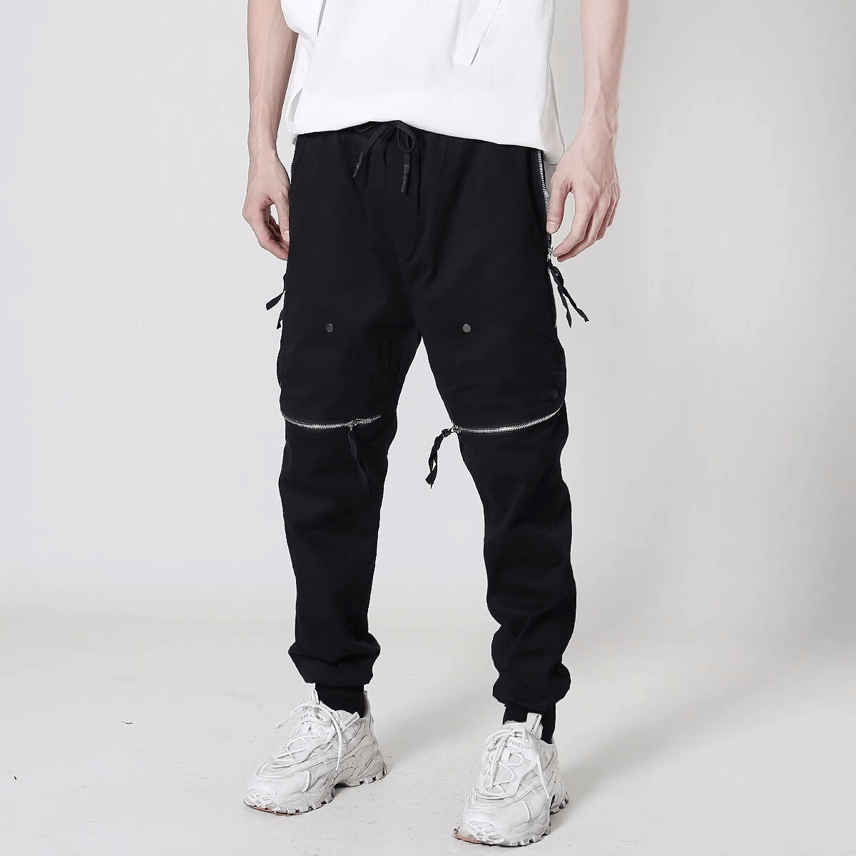 Men's tactical zipper trousers with elastic waist and unique design, perfect for stylish comfort and functionality.