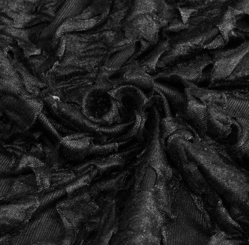 Close-up of textured black fabric showcasing ruffled details for gothic fashion designs, perfect for stylish skirts.