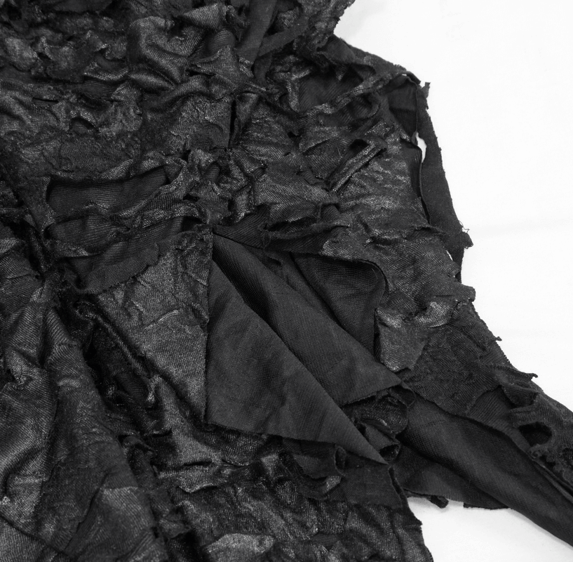 Close-up of a textured black fabric showing layers and ruffles, perfect for a gothic style women's skirt.