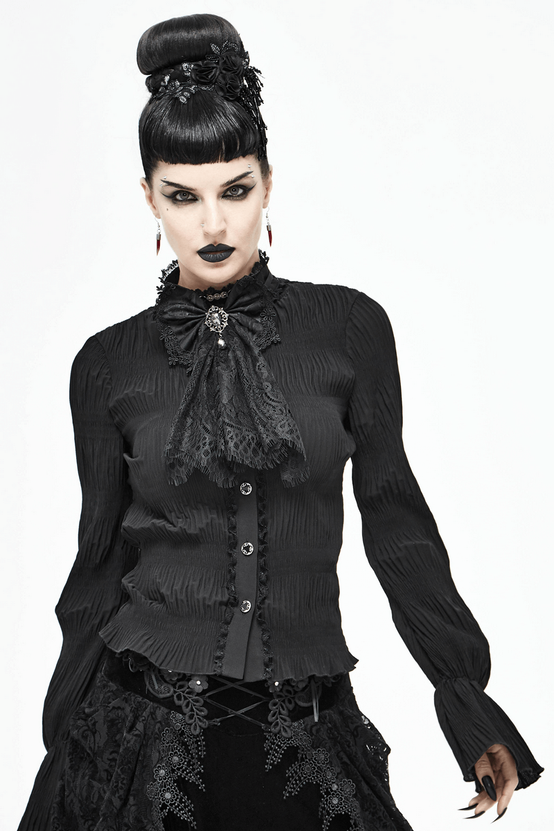 Fashionable woman in vintage gothic blouse with black lace bow tie and silver brooch for a stylish steampunk look.