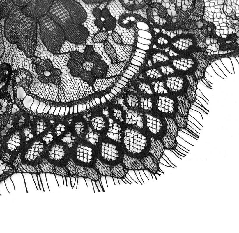 Close-up of elegant black lace fabric featuring floral patterns and intricate designs, perfect for gothic fashion accessories.