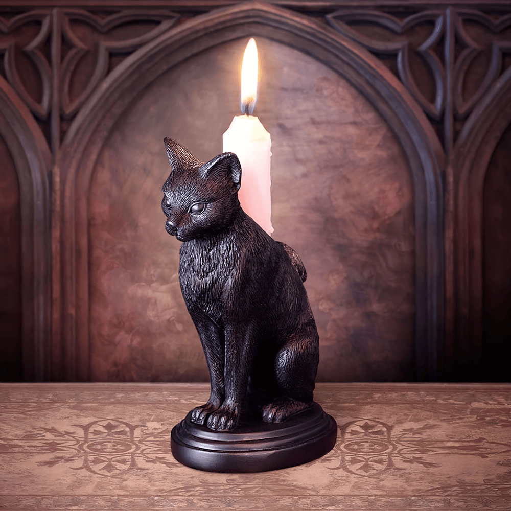 Faust's Familiar black cat candlestick holder with lit candle, perfect for witchy home decor and altars.