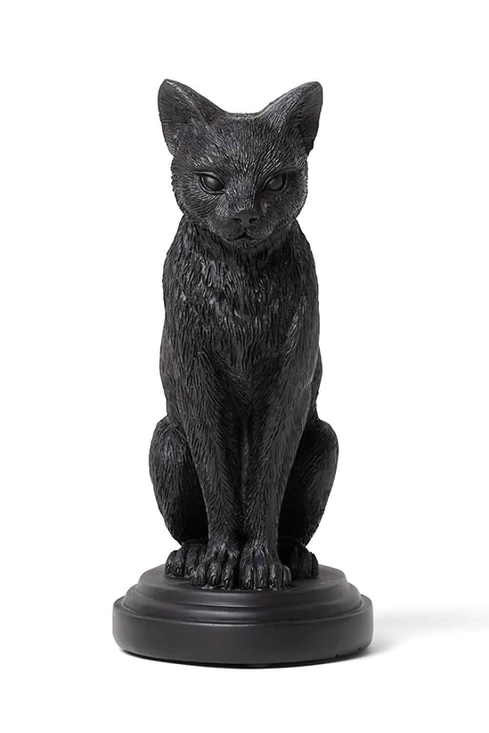 Sculpted black cat candlestick holder for witchy home decor, perfect for altars or dining tables.
