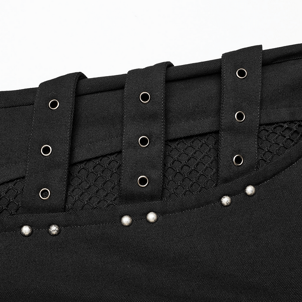 Close-up of punk style black pants with faux fur trim, mesh, and adjustable knee loops for edgy fashion.
