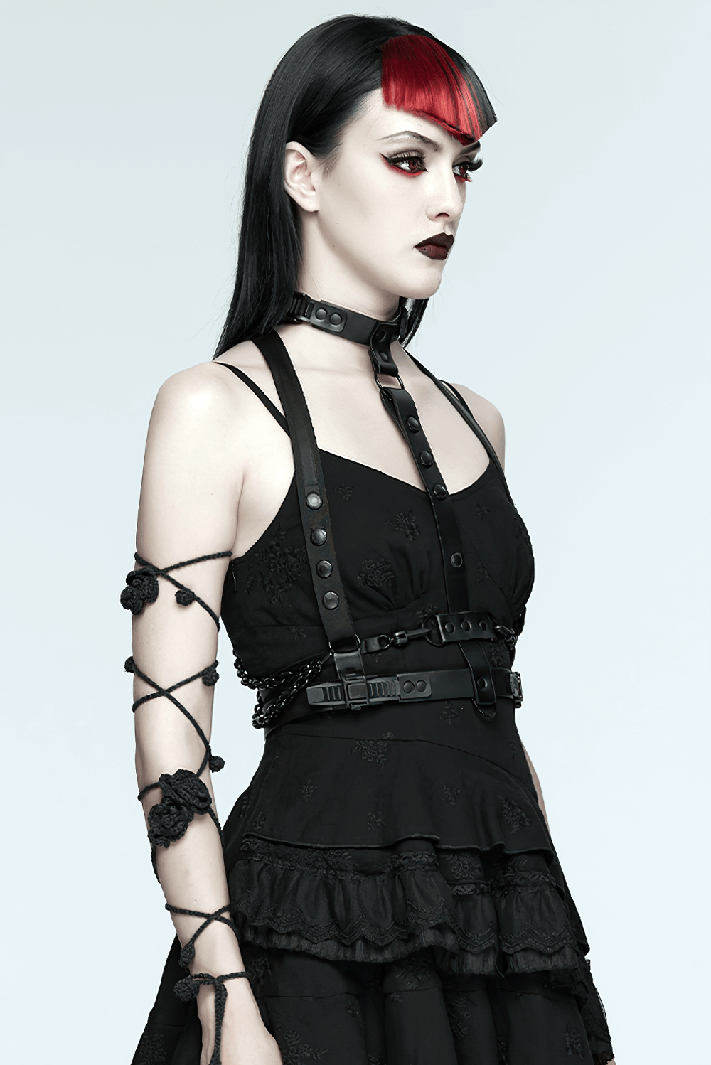 Faux Leather Cyberpunk Skeleton Harness with Chains styled with punk fashion model showcasing edgy designs.