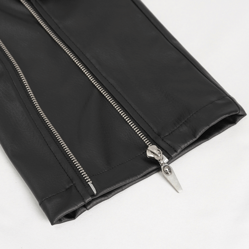 Close-up of faux leather fitted pants zipper detail, featuring sleek black fabric and punk-inspired design.