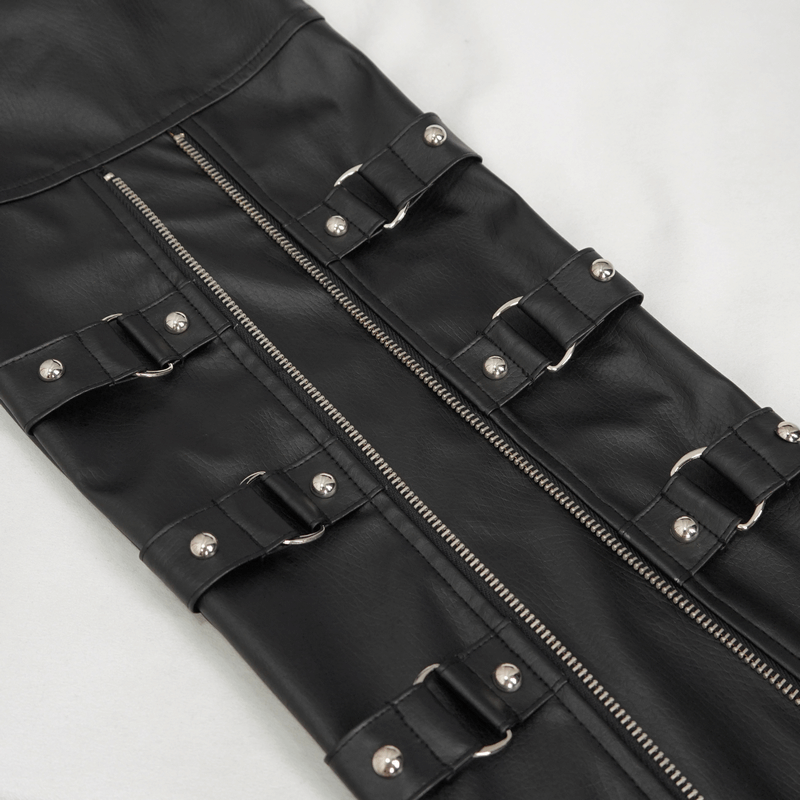 Close-up of black faux leather pants featuring detachable straps and silver buckles for a punk-inspired look.