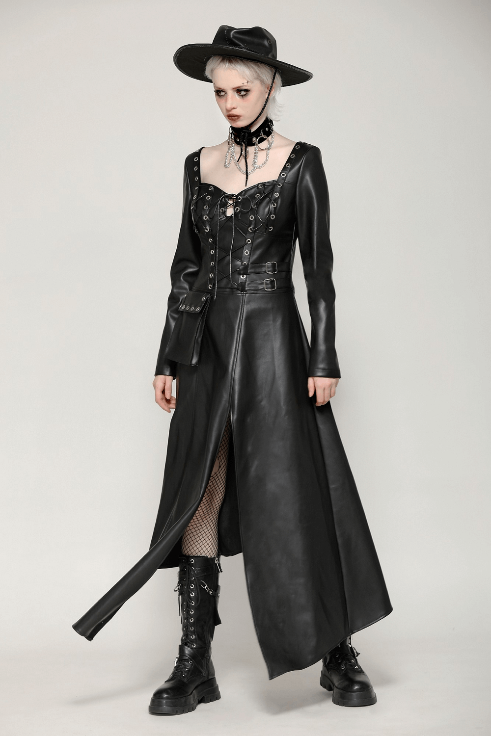 Dark aesthetic faux leather gothic dress with harness, lace-up detailing, and edgy accessories, perfect for statement looks.