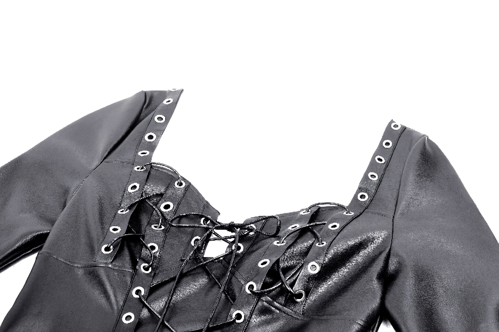 Close-up of faux leather gothic dress featuring lace-up detailing and grommet accents for a dark aesthetic look.