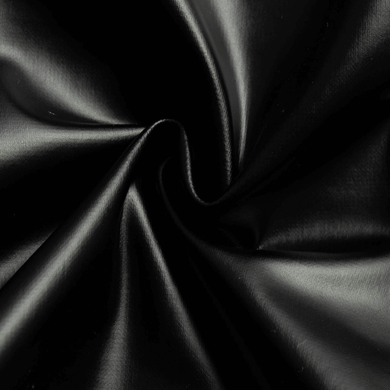 Close-up of sleek black faux leather fabric, perfect for grunge and gothic styles.