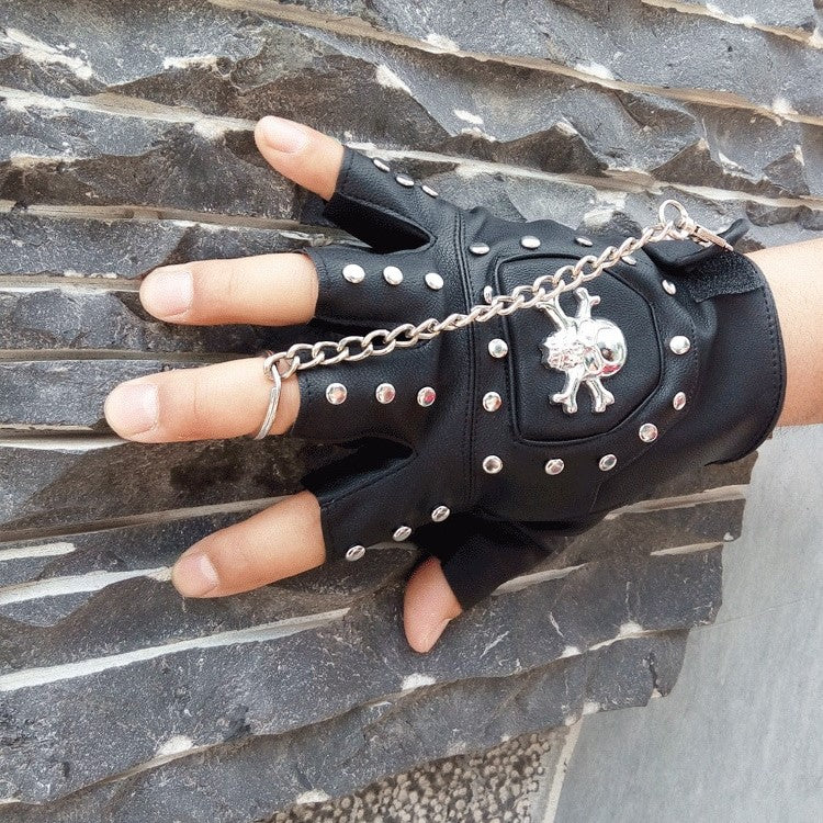 Faux leather half-finger gloves with metal skull and rivets, perfect for punk rock style.