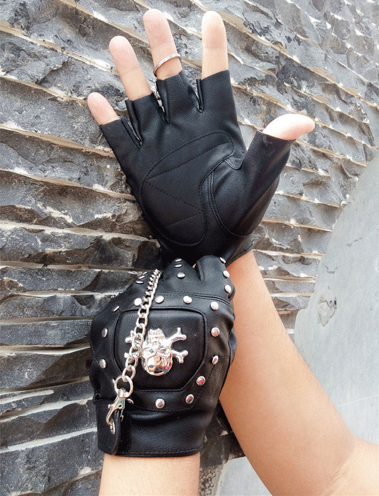 Faux leather half-finger gloves with skull detail and rivets, perfect for rock and goth fashion.