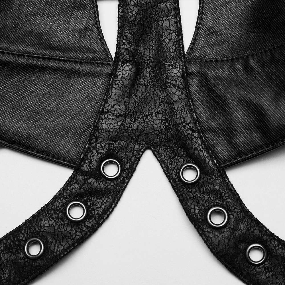 Close-up of black cracked faux leather lace-up top with eyelet details, showcasing edgy style and craftsmanship.