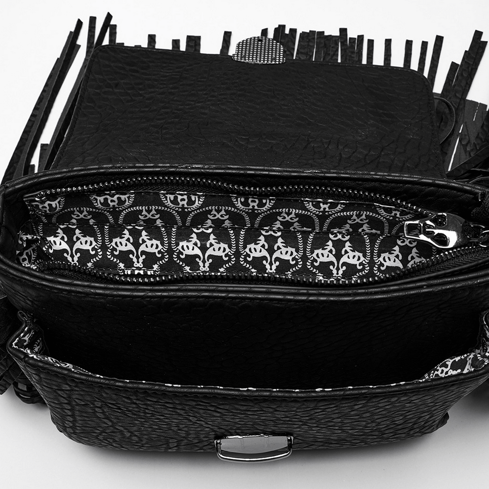 Interior view of faux leather skull tassel handbag showcasing intricate lining and zipper pocket details.