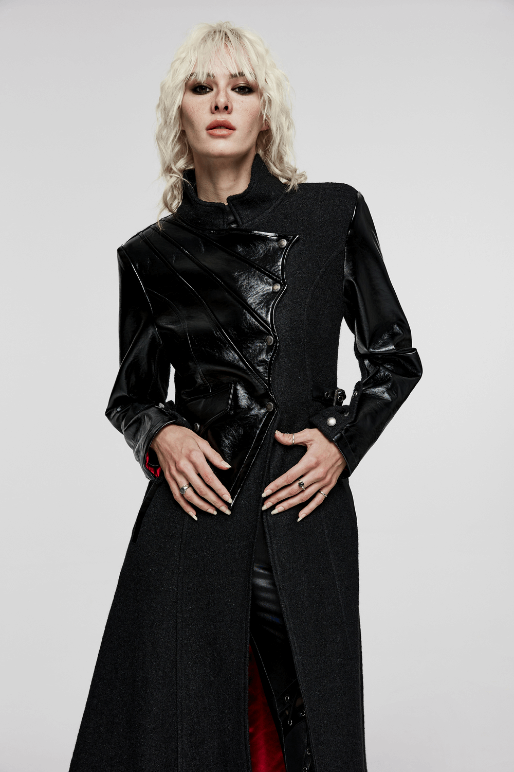 Gothic faux leather wool blend coat with asymmetrical detailing and diagonal pockets, perfect for high fashion looks.
