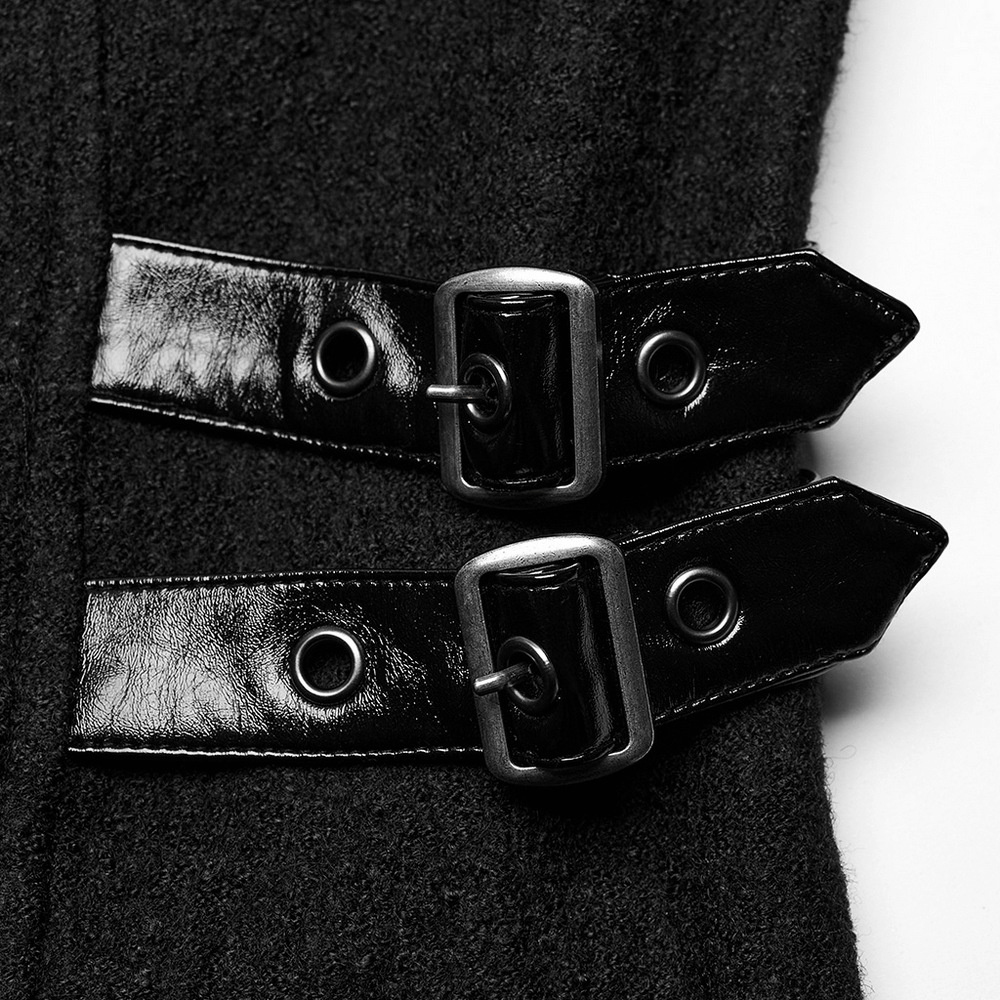 Close-up of faux leather detailing and buckle straps on Gothic thick coat.