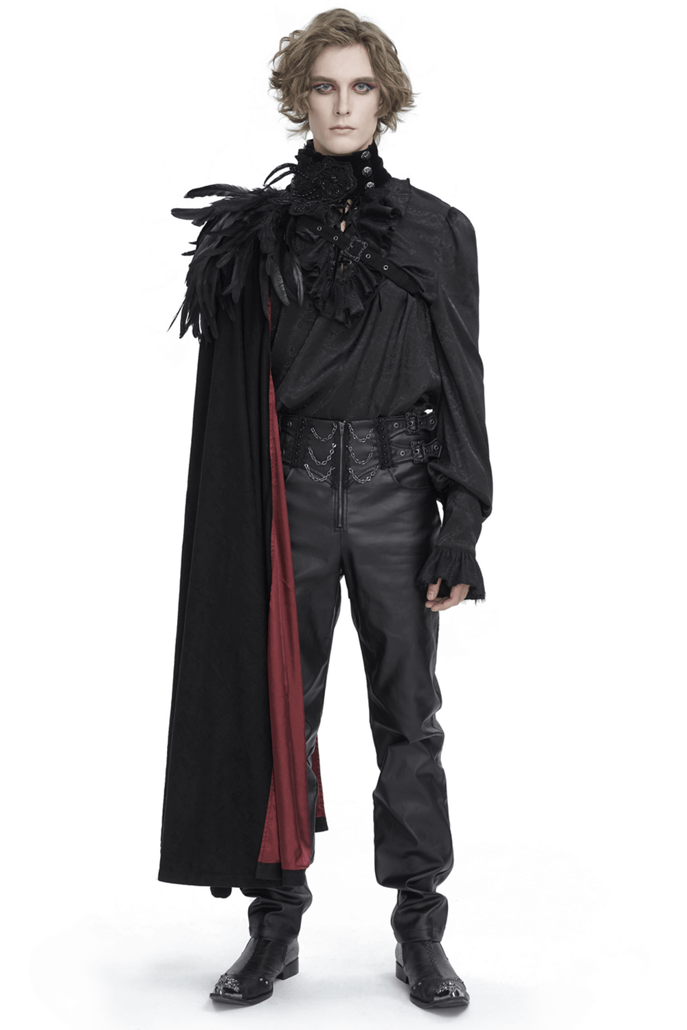 Chic model showcasing a feathered black asymmetric cape with red accents, perfect for glamorous evening events.