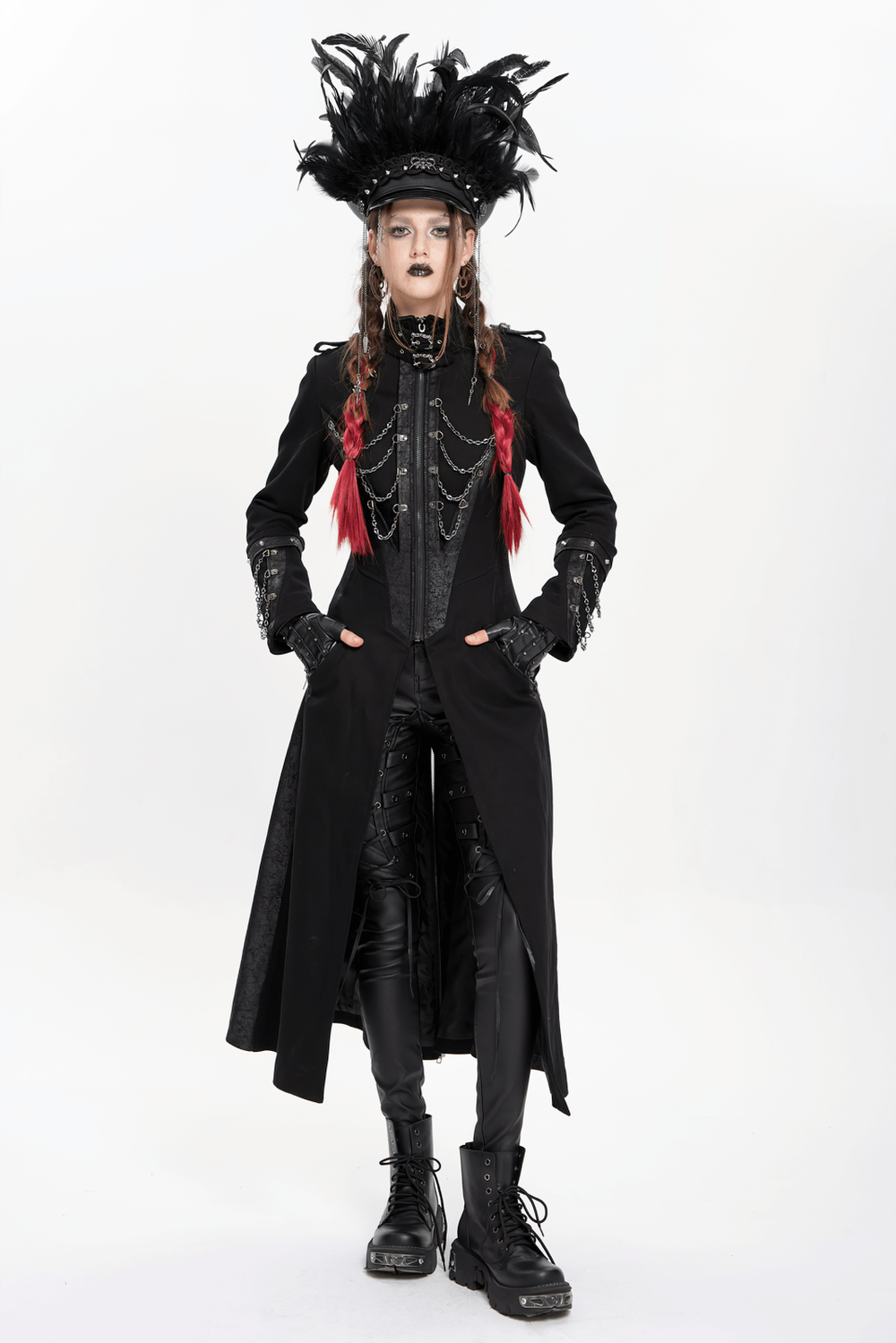 Gothic model wearing a feathered leather cap with lace and chains, styled in a dramatic black coat and combat boots.