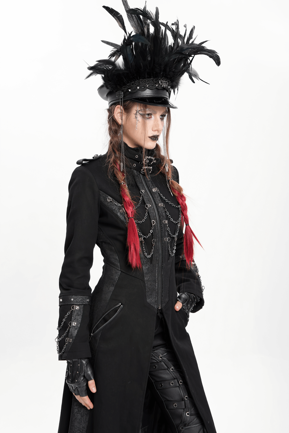 Gothic leather cap with feathers and chains, paired with a stylish black coat and dramatic makeup for an edgy look.